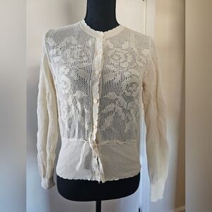 Peplum waist lace like sweater